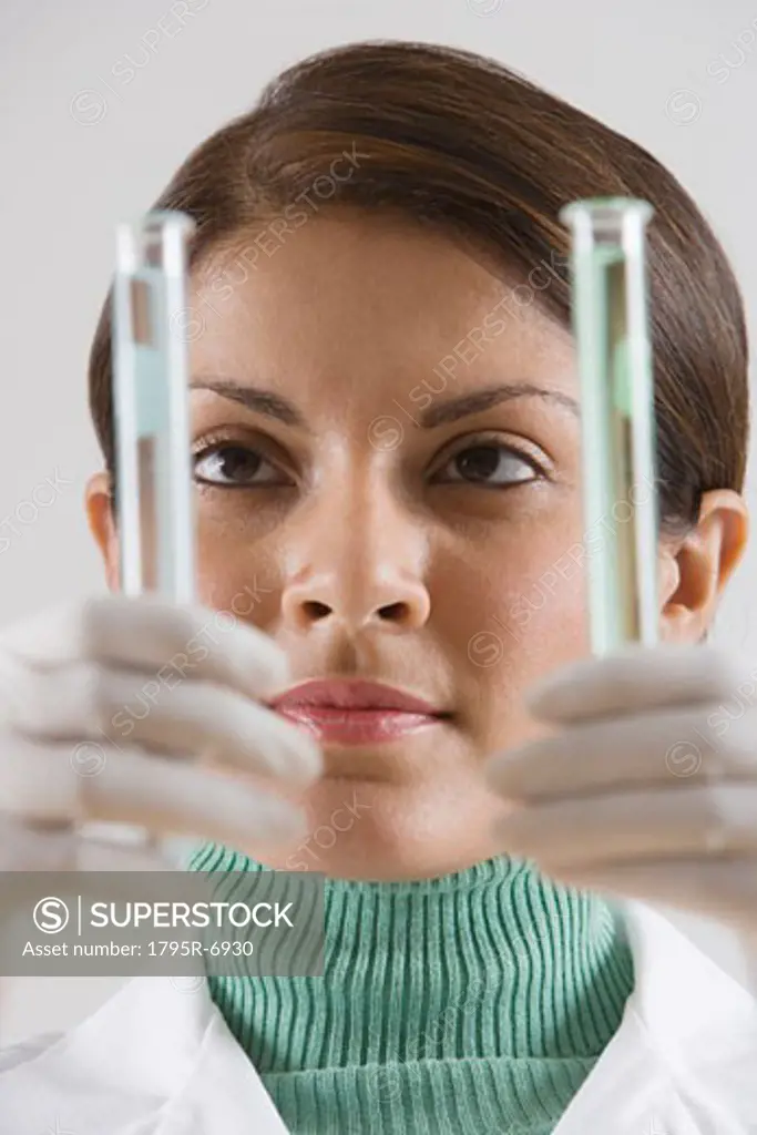 Indian female scientist looking at vials