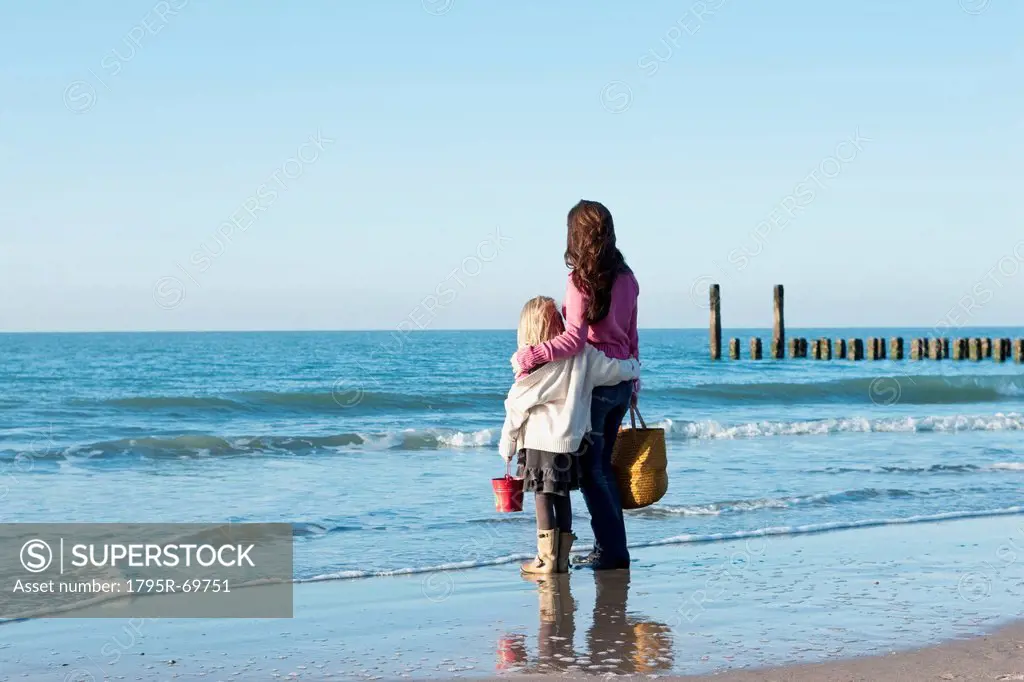 Netherlands, Zeeland, Haamstede, Mother with daughter on beach