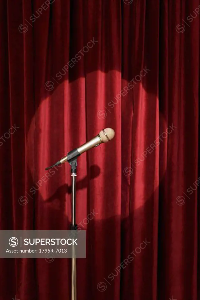 Spotlight on microphone on stage