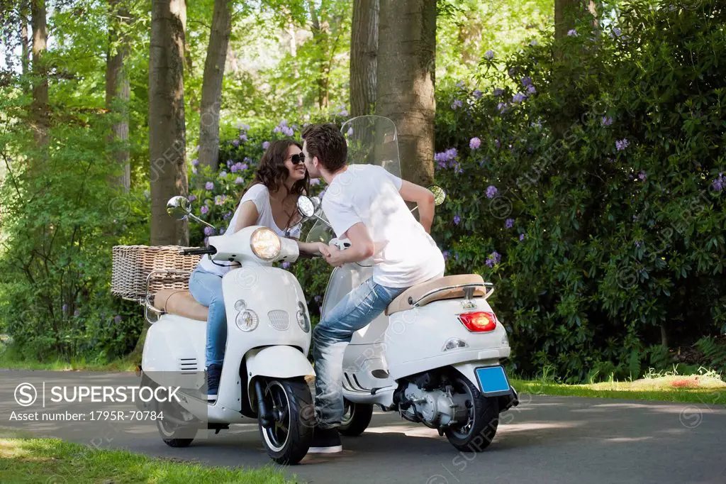 Couple on scooters