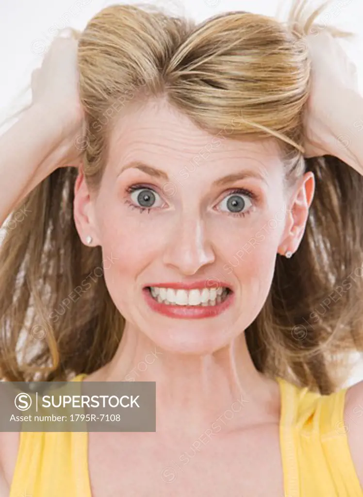 Frustrated woman pulling on hair