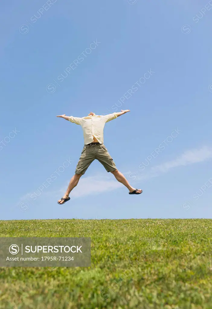 Man jumping on meadow