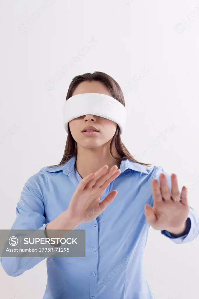 Studio shot of woman wearing blindfold