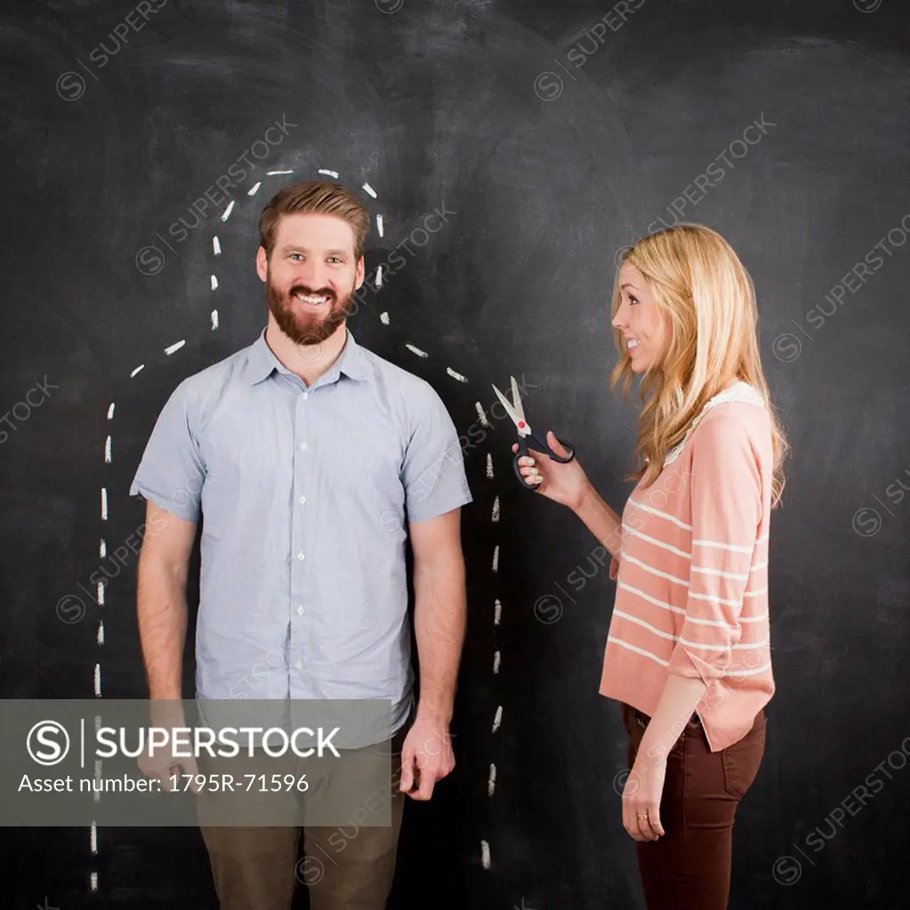 Young couple, man with chalk outline