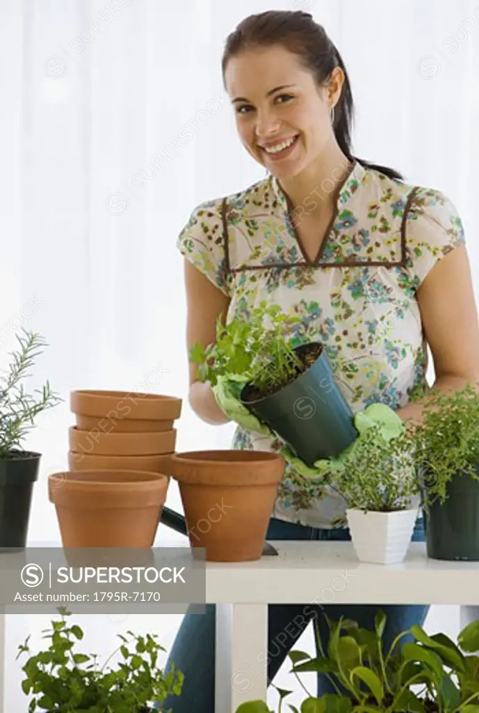 Woman potting plants
