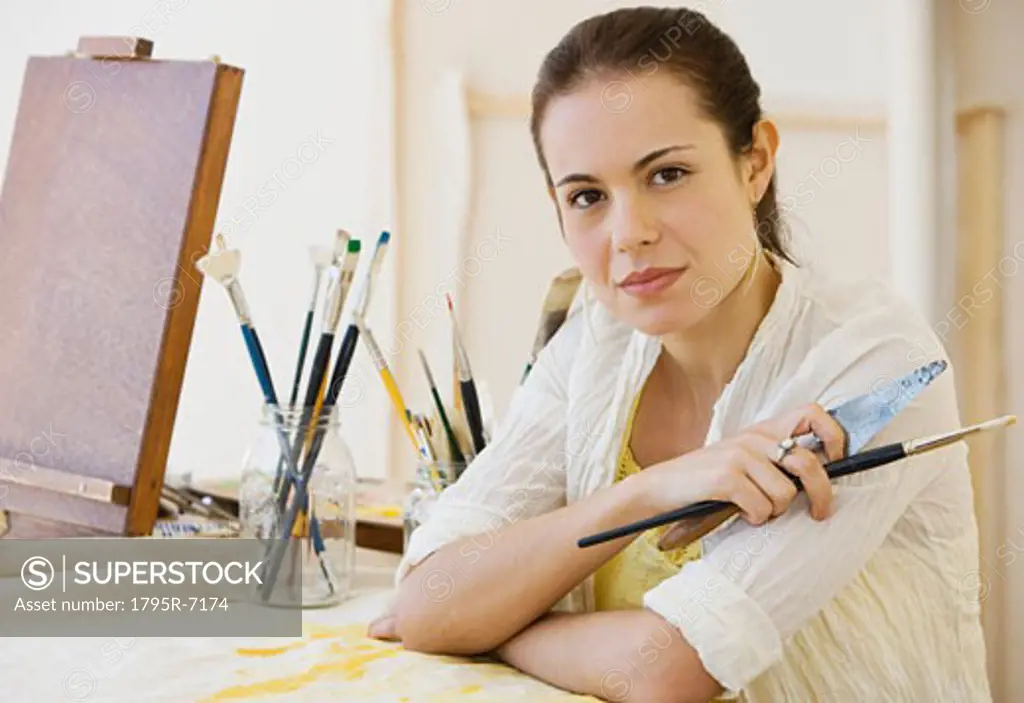 Female artist in painting studio