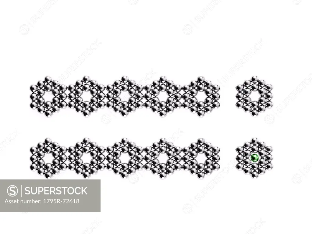 Studio shot of Pachinko balls arranged in two rows of hexagons