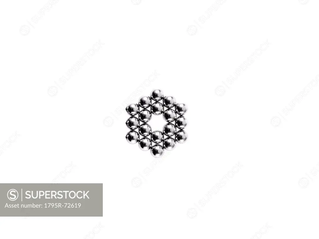 Studio shot of Pachinko balls arranged in hexagon