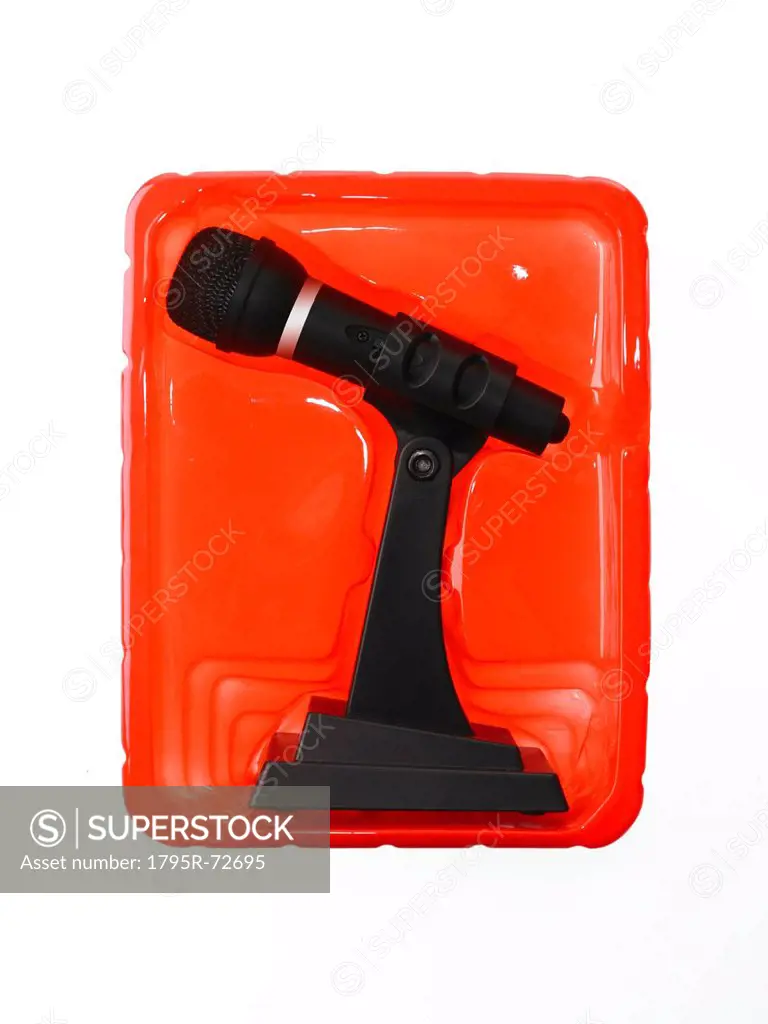 New wireless microphone still in case on red background