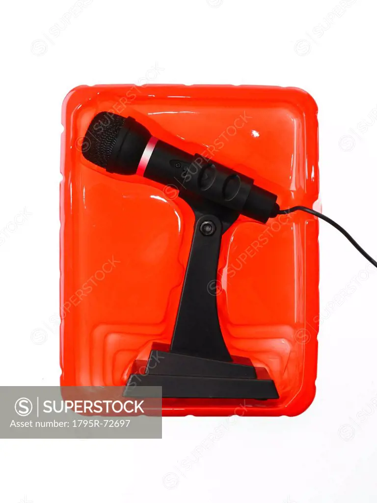 New microphone still in case on red background
