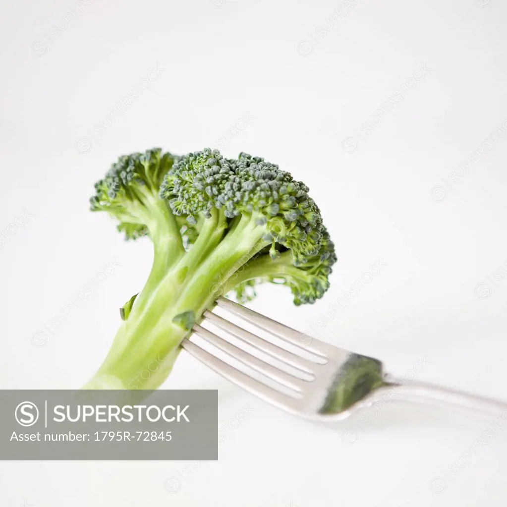 Broccoli on fork, studio shot