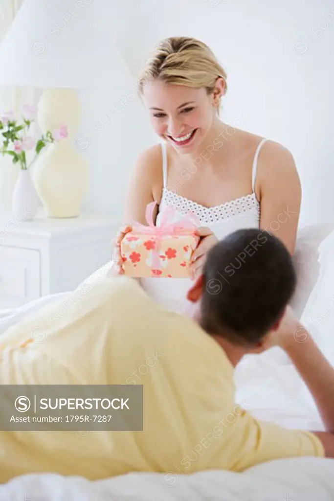 Woman holding gift from husband