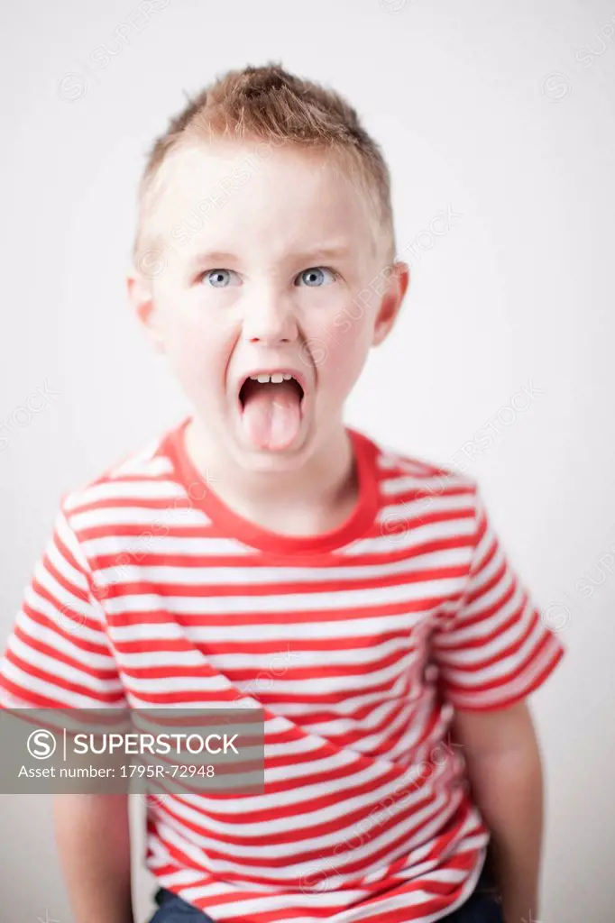 Portrait of toddler boy 2_3 sticking out tongue
