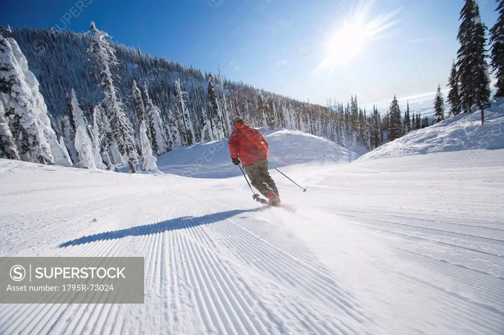 Man skiing in mountain scenery
