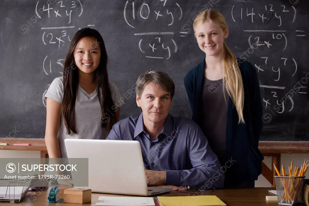 Portrait of maths teacher with two students 14_15