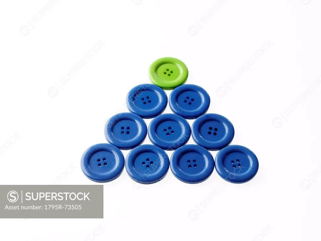 Studio shot of blue and green buttons arranged in triangle