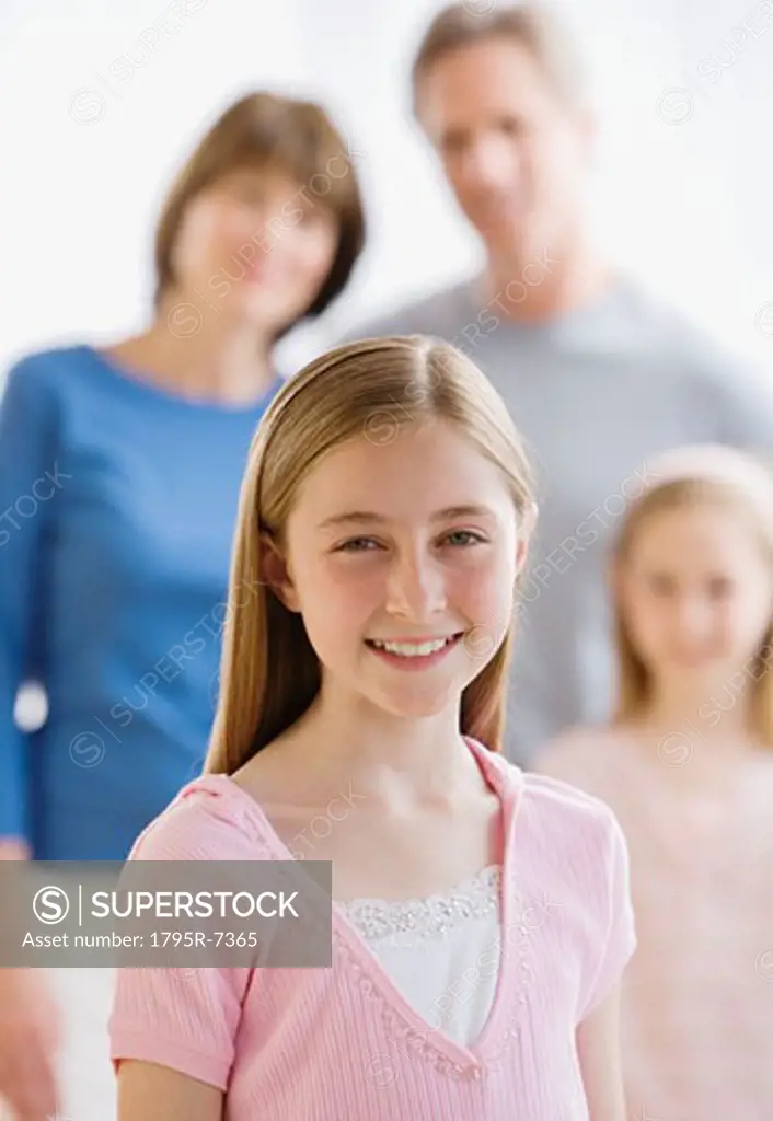 Portrait of girl in front of family