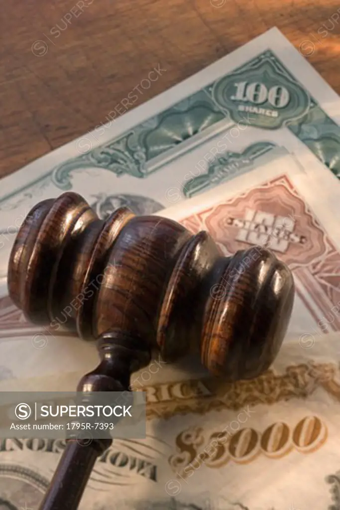 Judge's gavel on bank notes