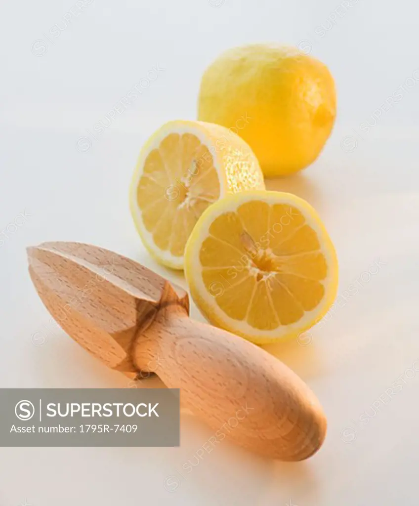 Lemon halves and hand juicer