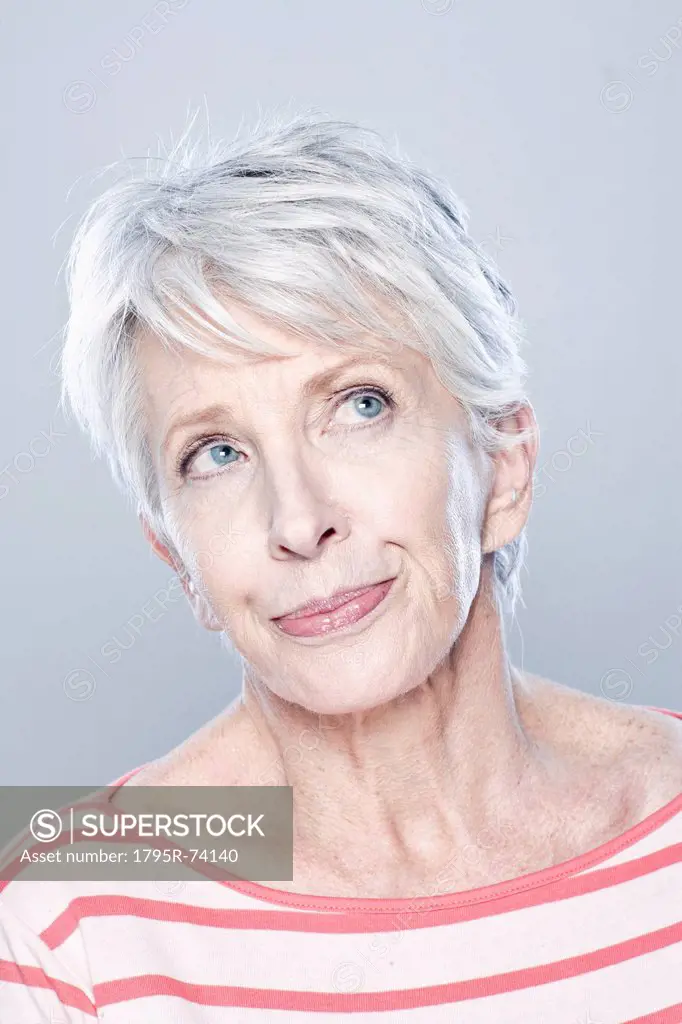 Portrait of thoughtful senior woman, studio shot