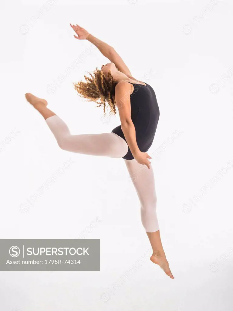 Female ballet dancer during practicing, studio shot