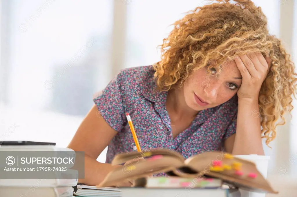 Young woman studying in library