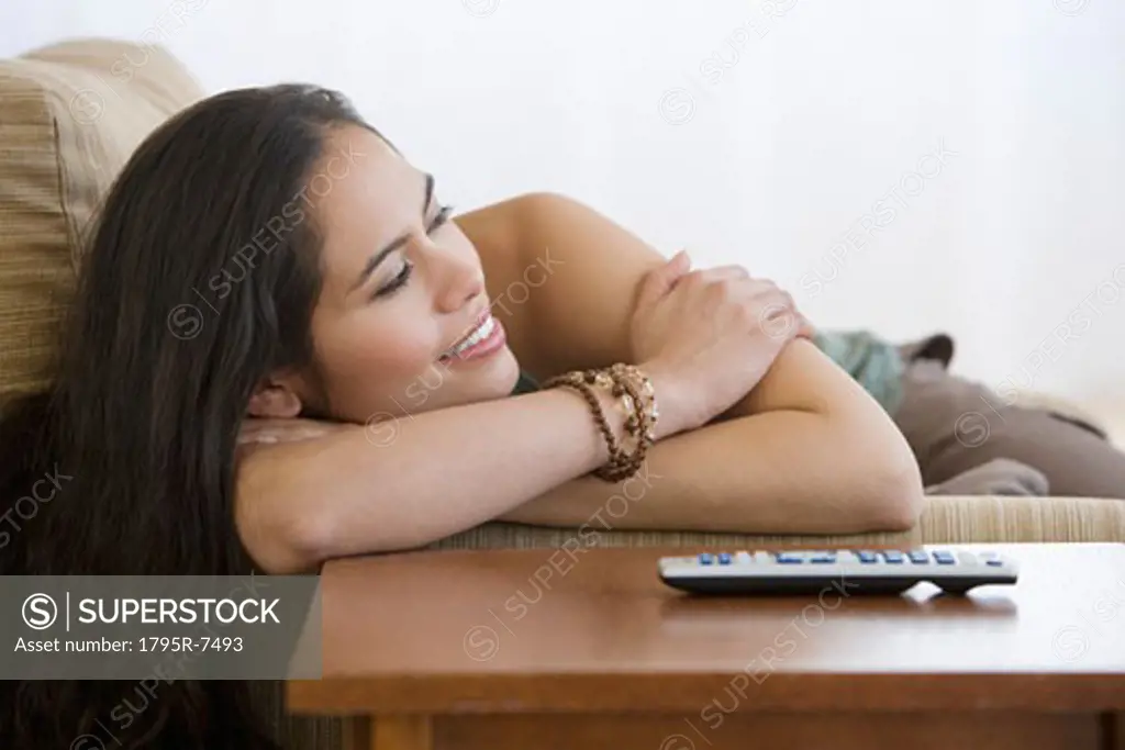 Woman laying on sofa