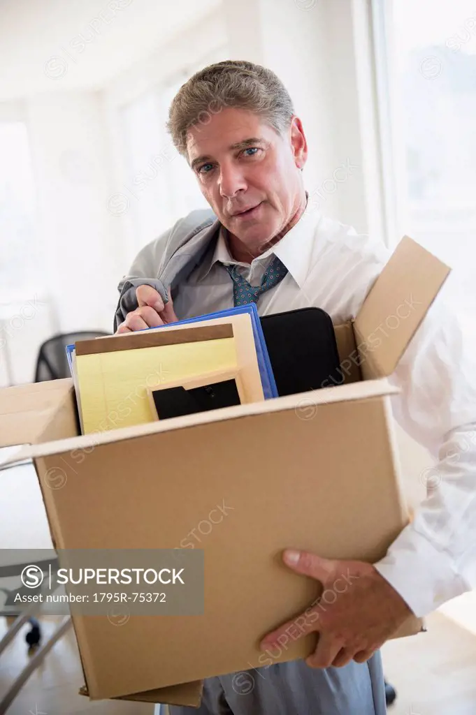 Office worker with packed carton box