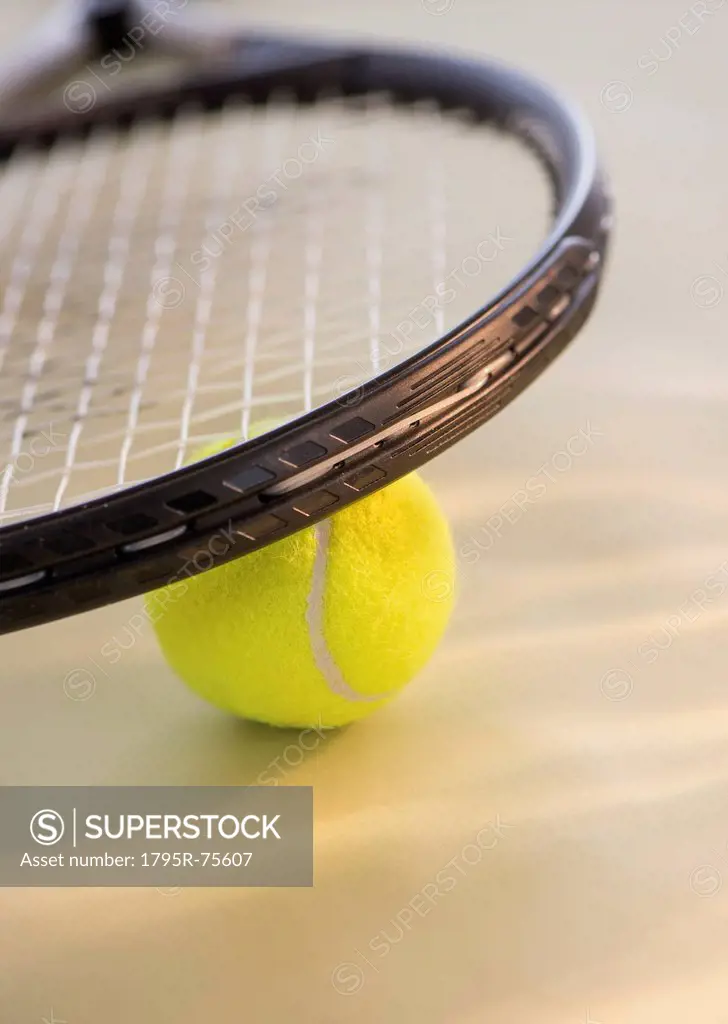 Studio Shot of tennis racket with ball
