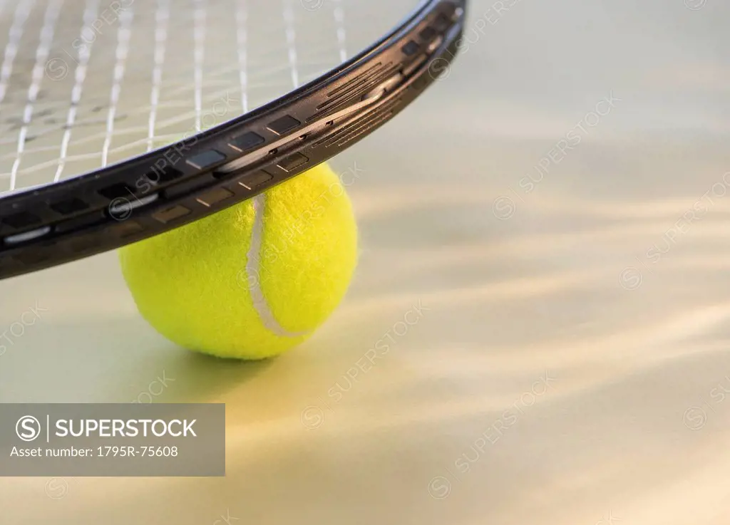 Studio Shot of tennis racket with ball