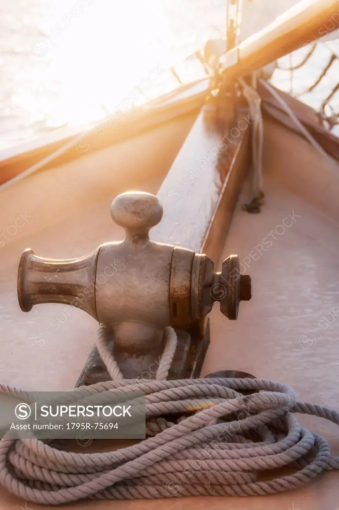 Rope coiled on yacht bow in sunset light