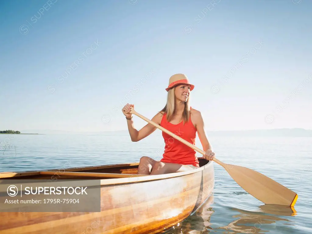 Portrait of young woman canoe traveling