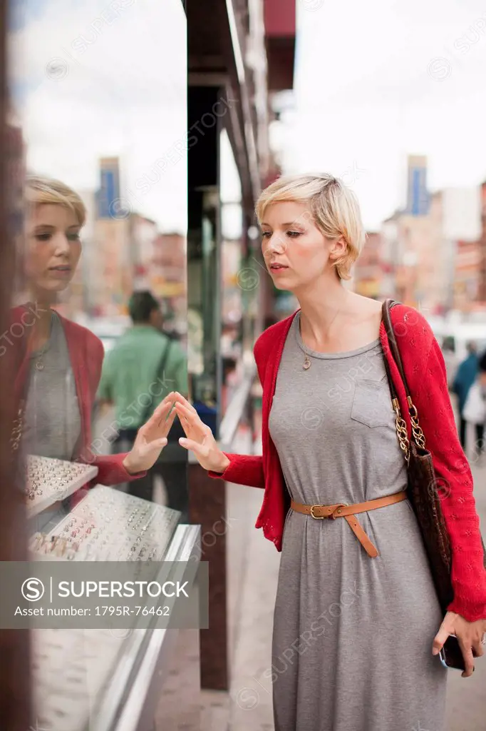 Woman looking at shop display