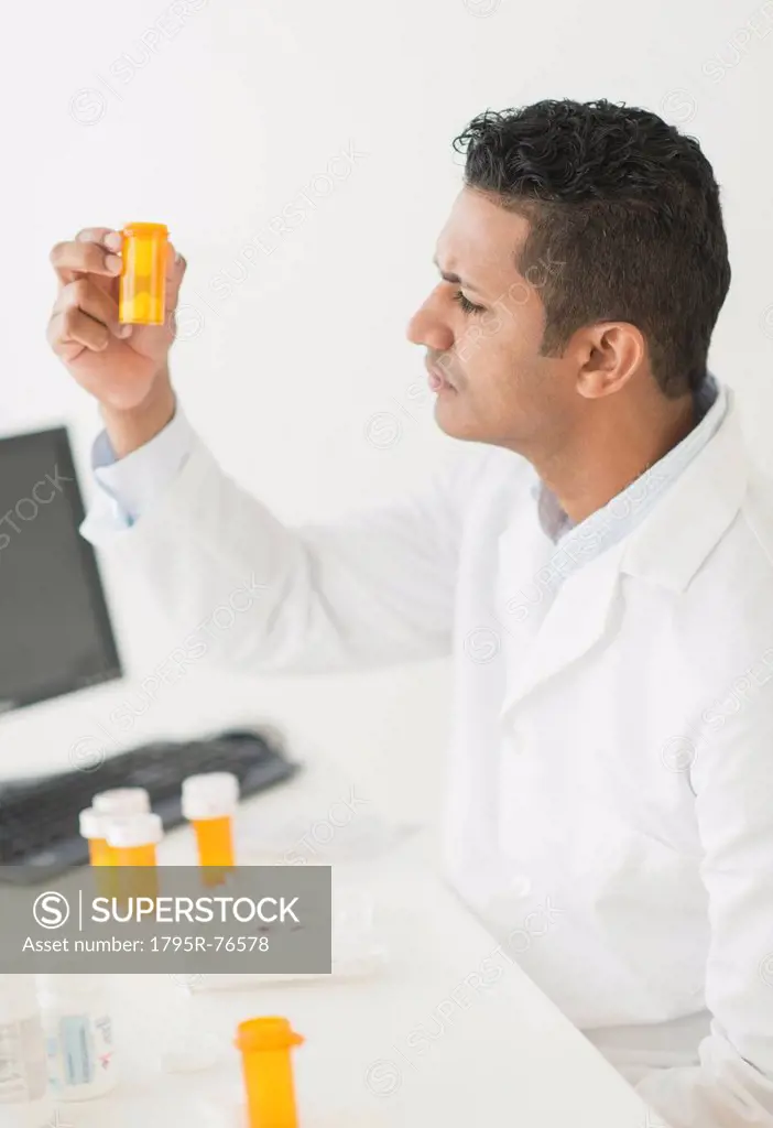 Pharmacist preparing prescription pills