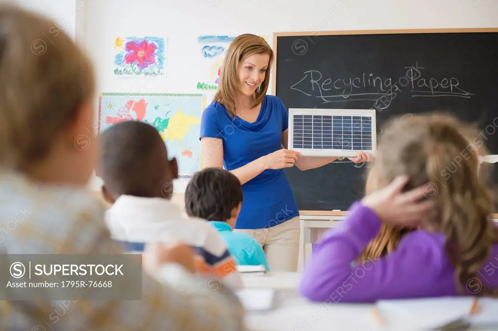 School children 8_9 with female teacher during class