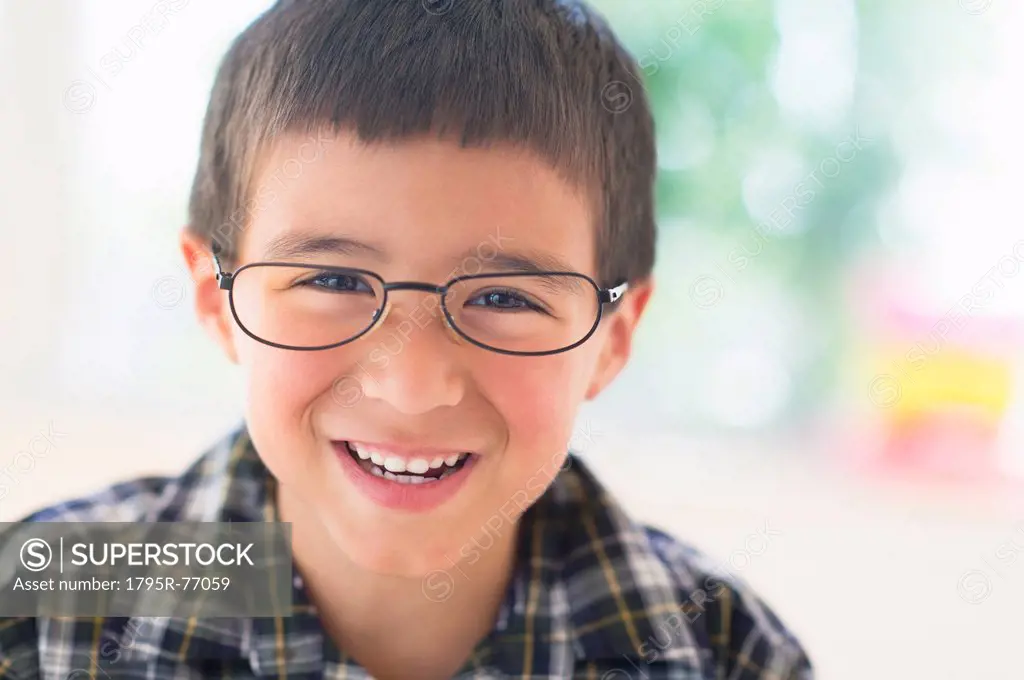 Portrait of boy 6_7 wearing glasses