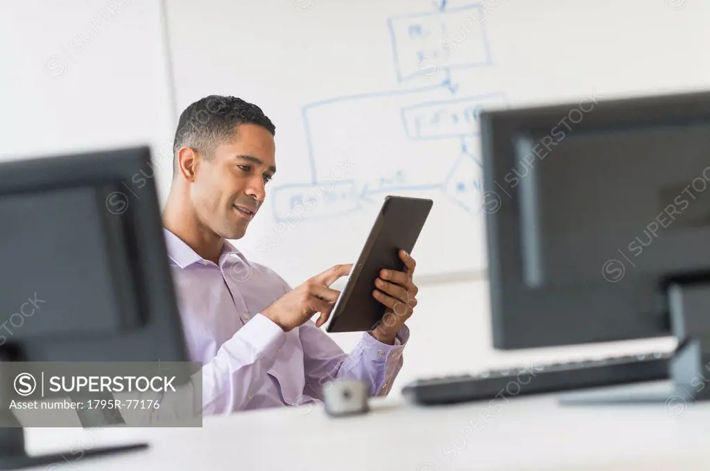 Male business executive working at desk