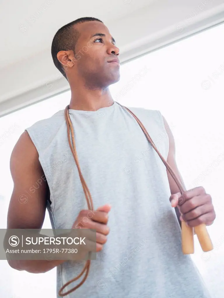 Young man with skipping rope