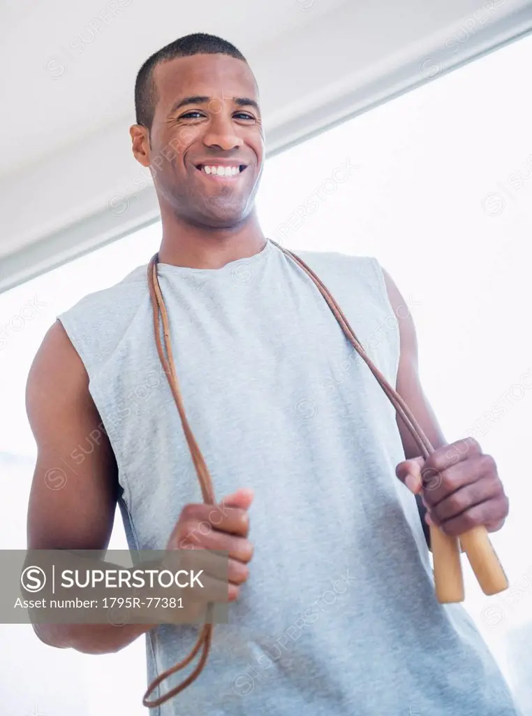 Young man with skipping rope