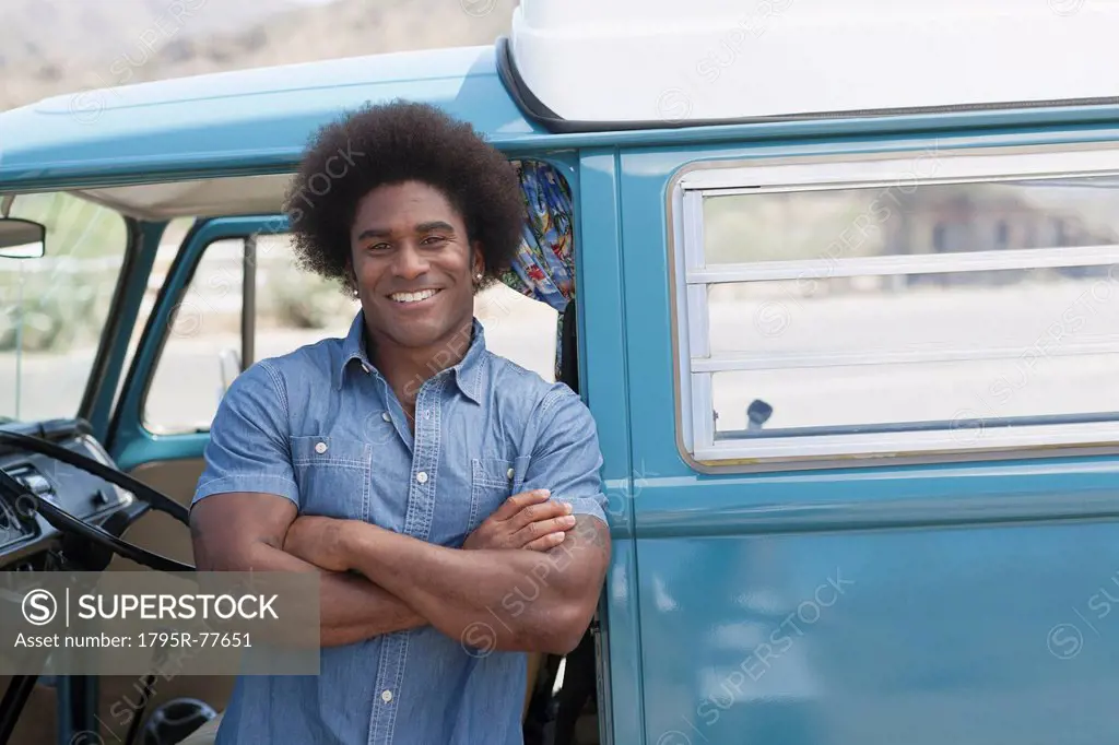 Portrait of man standing at van