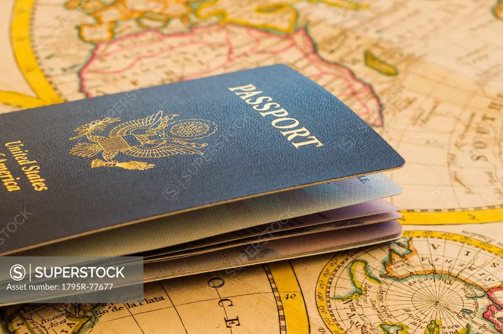 Passport sitting on antique map