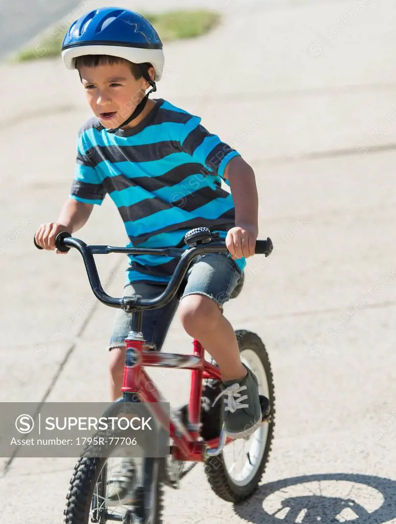 Boy 6_7 riding bicycle