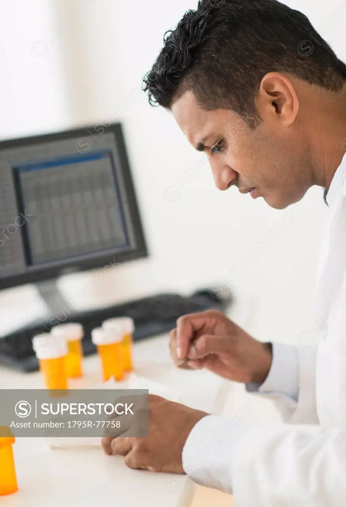 Pharmacist preparing prescription medicine