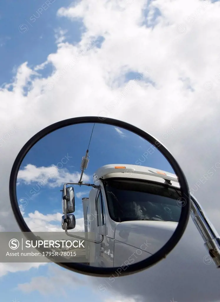 Reflection of semi_truck in side view mirror