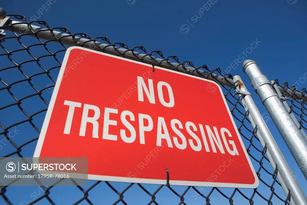 Low angle view of no trespassing sign