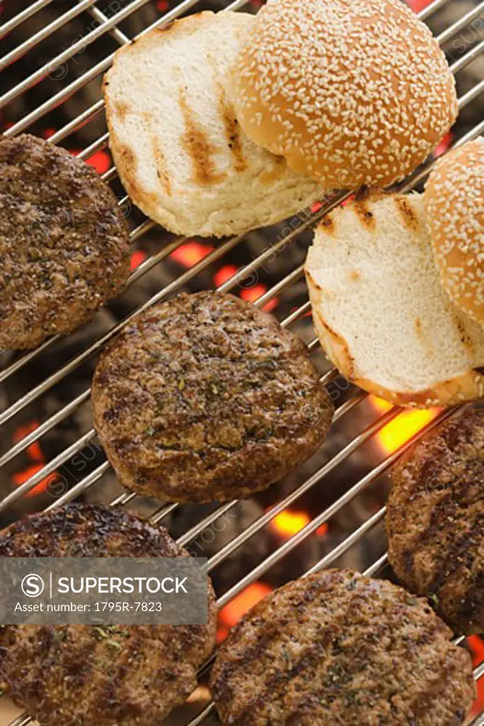 Hamburgers cooking on grill