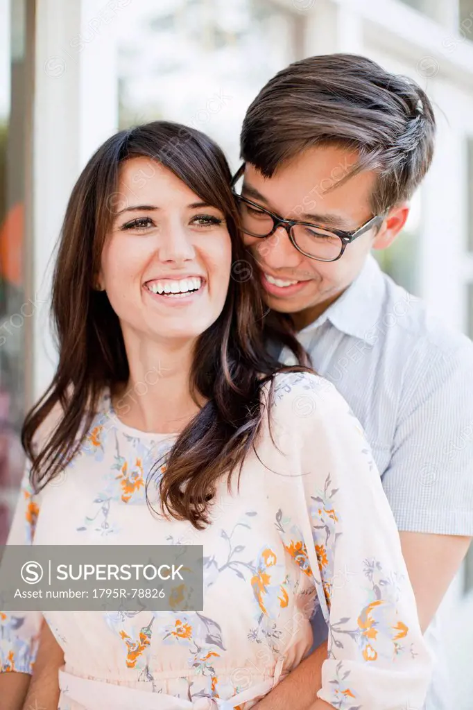 Portrait of couple embracing outdoors