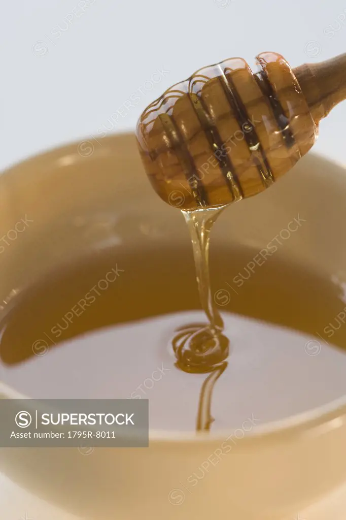 Close-up of honey dipper in honey
