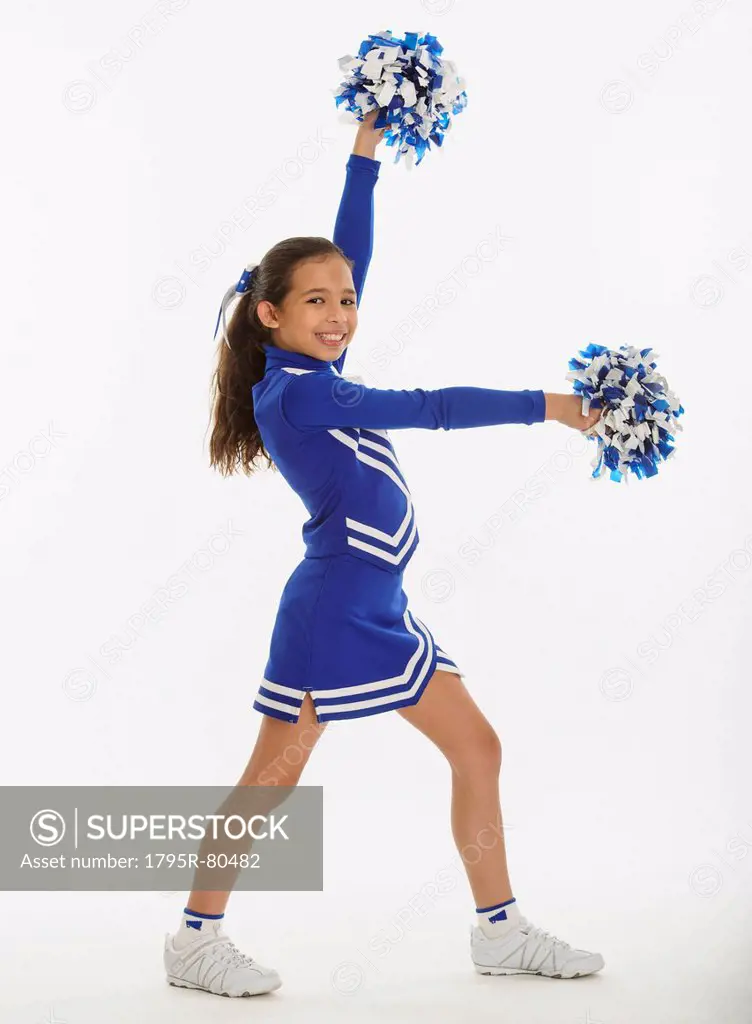 Portrait of cheerleader  10_11 years holding pom_pom