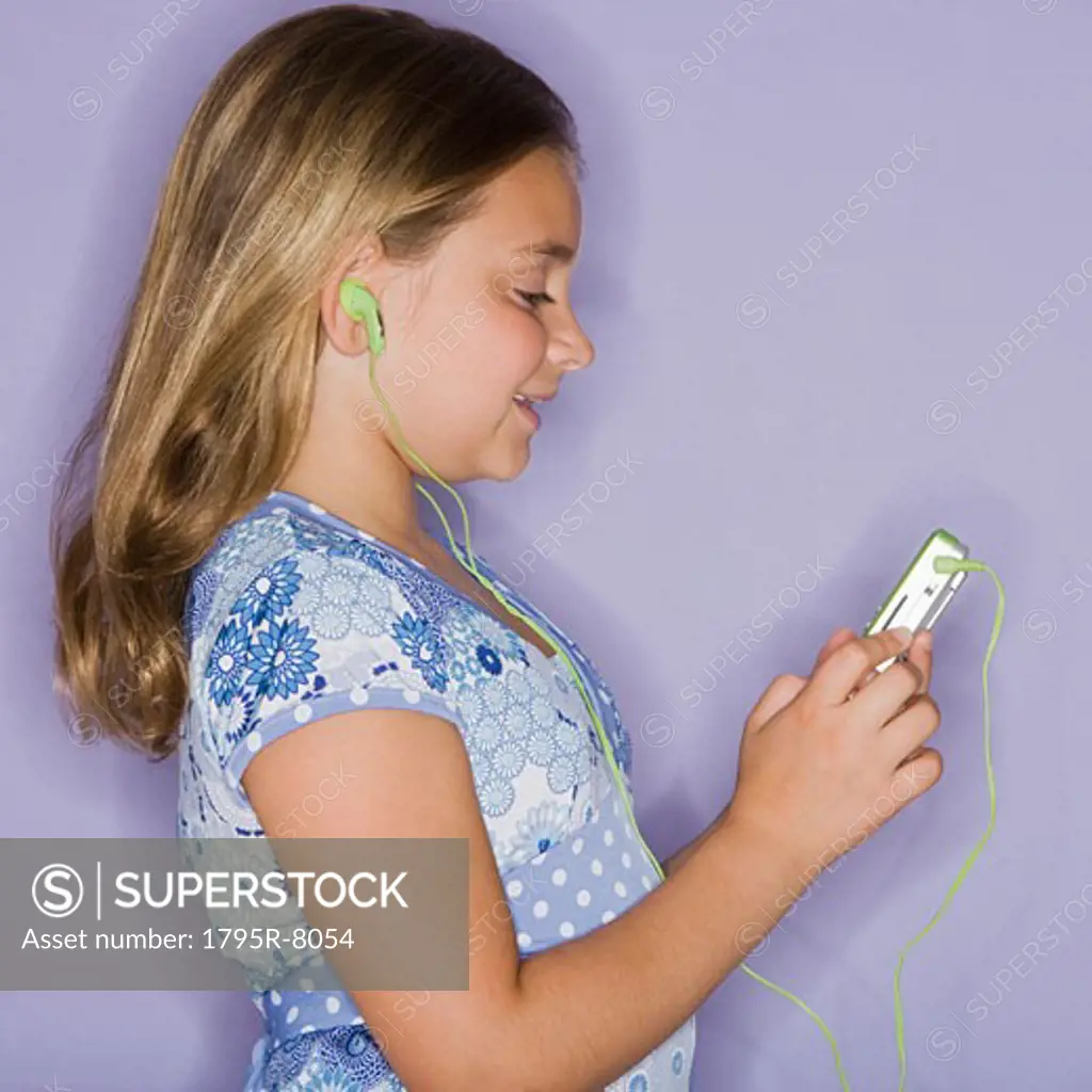Girl listening to mp3 player